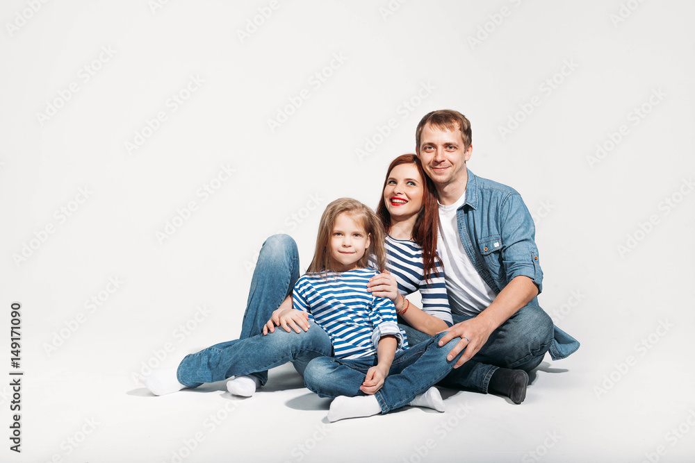 Happy family portrait sitting on white background isolated Happy family portrait sitting on white background isolated