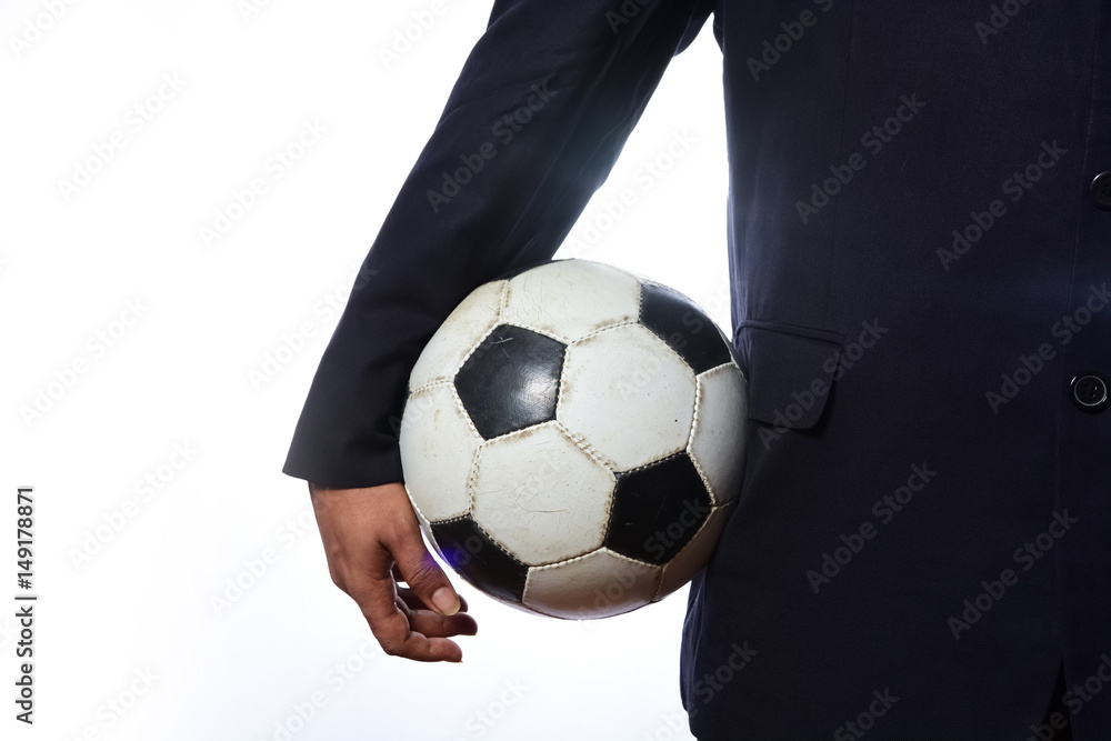 Businessman holding football ball Businessman holding football ball