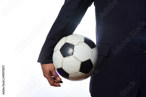 Businessman holding football ball © suman
