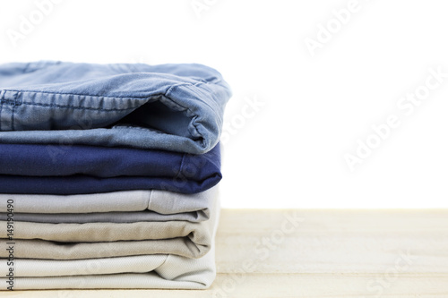 Pile of clothes on wood,white background.