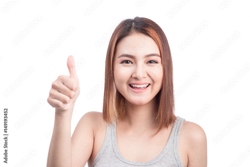 Cheerful lovely girl looking at camera showing thumbs up over white background. Cheerful lovely girl looking at camera showing thumbs up over white background.