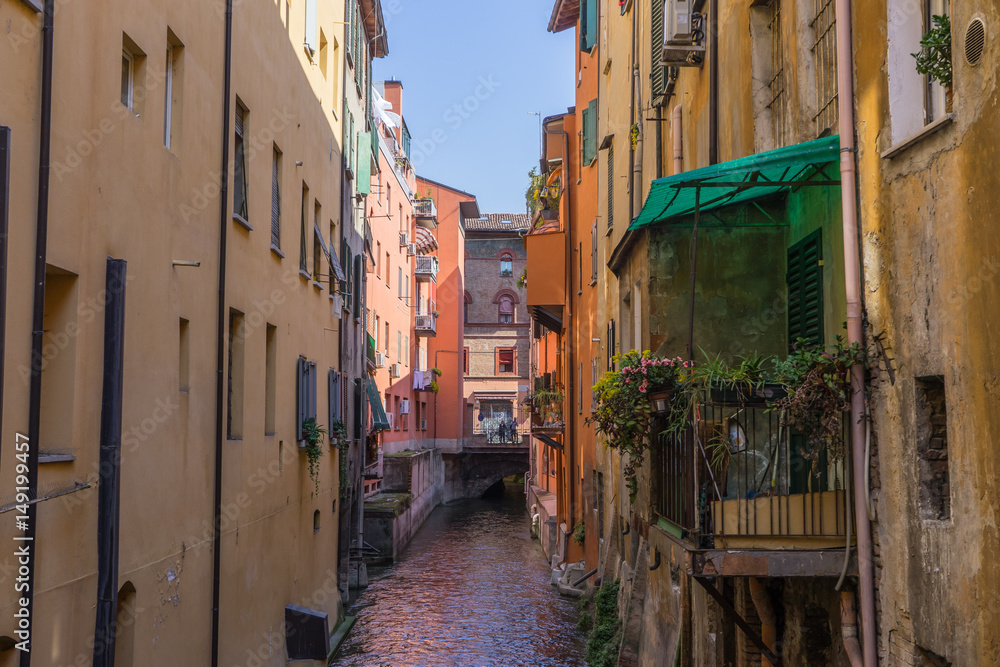 Colorful water canal in downtown Bologna, Italy