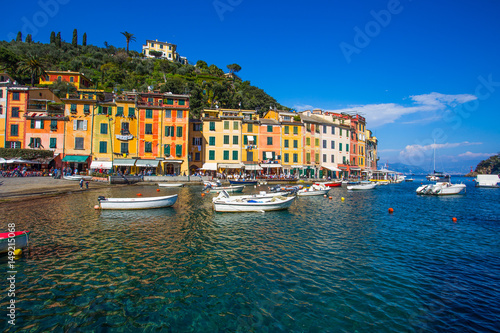 Fototapeta Naklejka Na Ścianę i Meble -  PORTOFINO, ITALY, APRIL 8, 2017 - View of Portofino, an Italian fishing village, Genoa province, Italy. A tourist place with a picturesque harbour and colorful houses