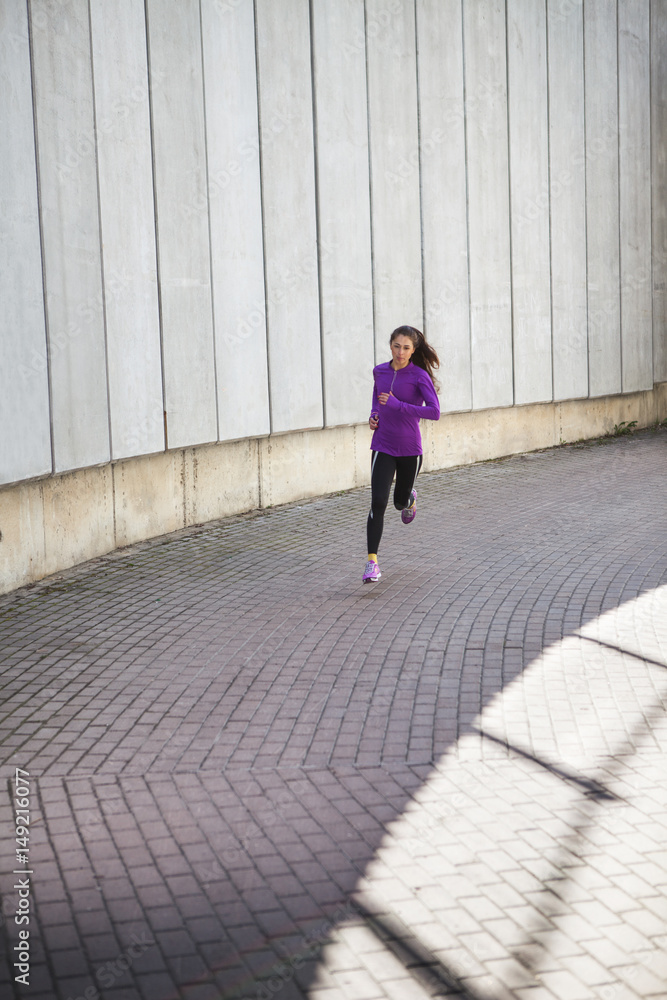 young sporty woman running