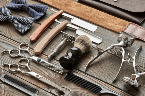 Vintage barber shop tools on wooden background