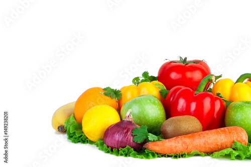 Fresh vegetables and fruits on isolated background. Close-up of vegetables. Tomato  pepper  carrots  onions  kiwi  lemon  orange  apple