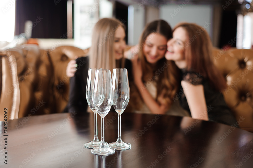 empty glasses of champagne on the background of the girls empty glasses of champagne on the background of the girls