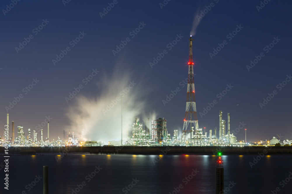 Flare Stack and Harbor Industry At Night