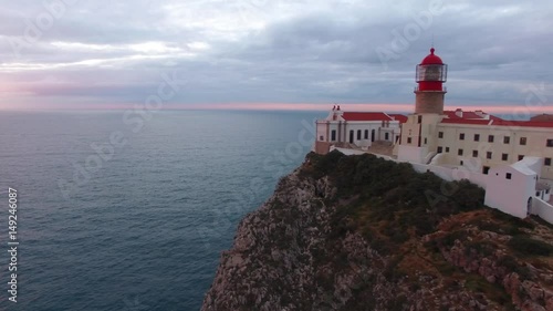 Aerial View lighthouse and cliffs at Cape St. Vincent at sunset. Europe's most South-western point, Sagres, Algarve, Portugal.