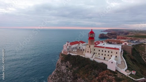 Aerial View lighthouse and cliffs at Cape St. Vincent at sunset. Europe's most South-western point, Sagres, Algarve, Portugal.