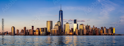 Panoramic of New York City Financial District skyscrapers and Hudson River at sunset. Lower Manhattan