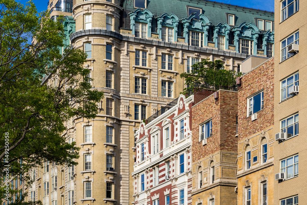 Obraz premium Facades of high-rise buildings on Central Park West. Upper West Side on sunny morning. Manhattan, New York City