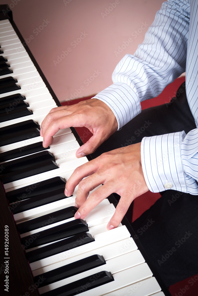 Man hands playing piano. Music and art background. Favorite music instrument of classic music. Man hands playing piano. Music and art background. Favorite music instrument of classic music.