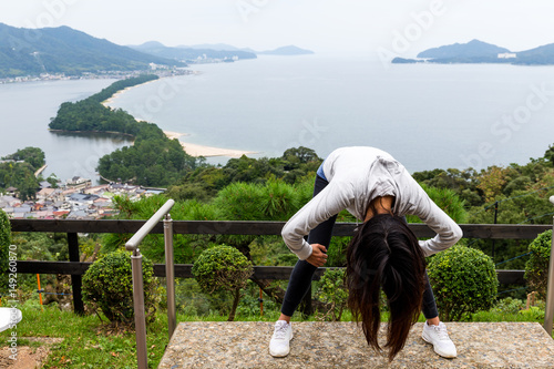 Woman upside down and viewing of Amanohashidate in Kyoto photo