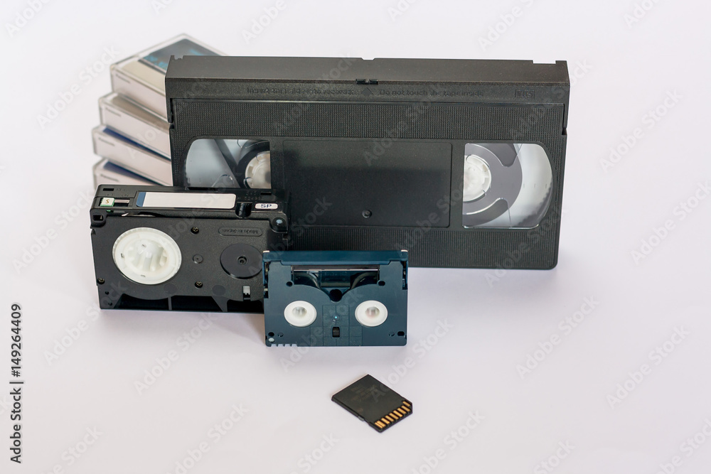 Mini dv and VHS video tape isolated on white. SD and MicroSD cards.  Cassettes. Stock Photo | Adobe Stock