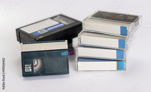 MiniDV  and  VHS video tape isolated on white. Casettes.