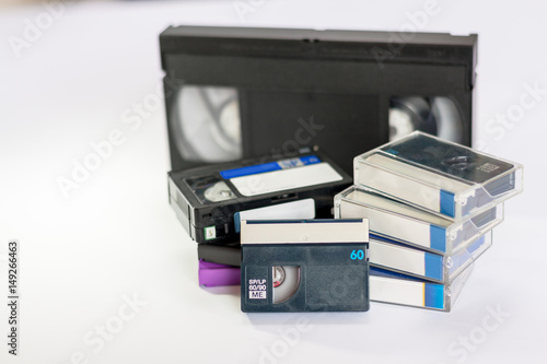 Mini dv and  VHS video tape isolated on white photo