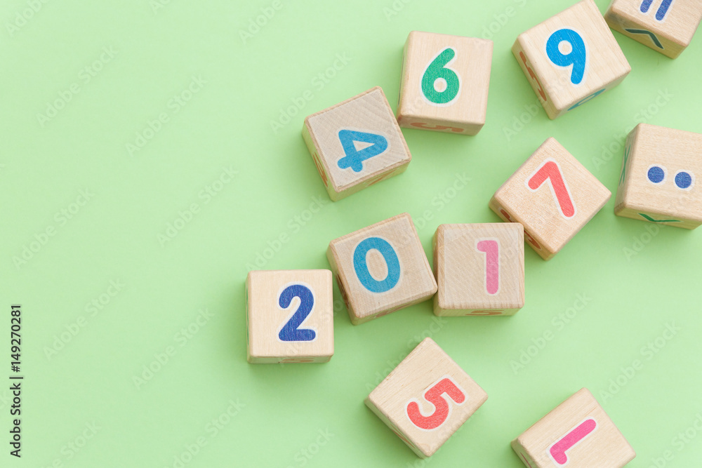 Top view on wooden cubes with numbers on light green background Top view on wooden cubes with numbers on light green background