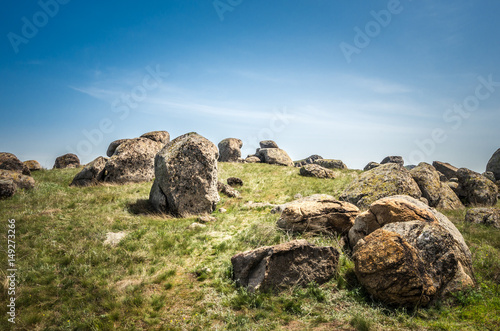 Rocks formations in Dobrogea, Tulcea county, Romania. Naturally formed piles of large rocks in Macin Mountain the olders alps in Europe