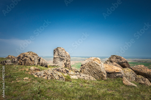 Rocks formations in Dobrogea, Tulcea county, Romania. Naturally formed piles of large rocks in Macin Mountain the olders alps in Europe © Lucian Bolca