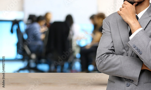 business man thinking with meeting team background