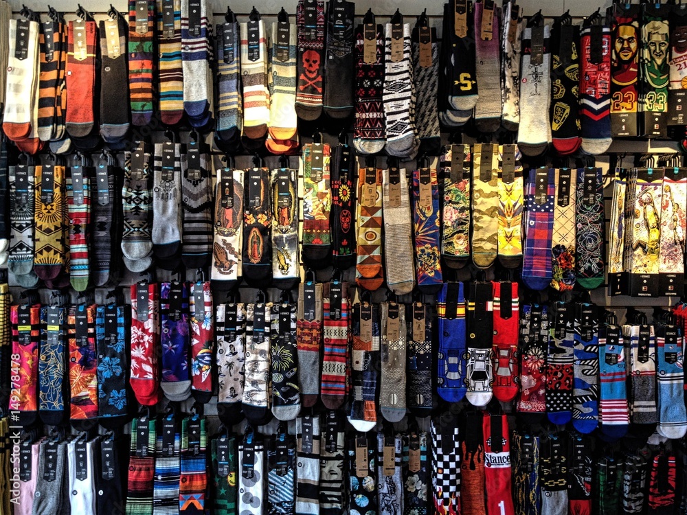 Colorful socks with prints on display in store