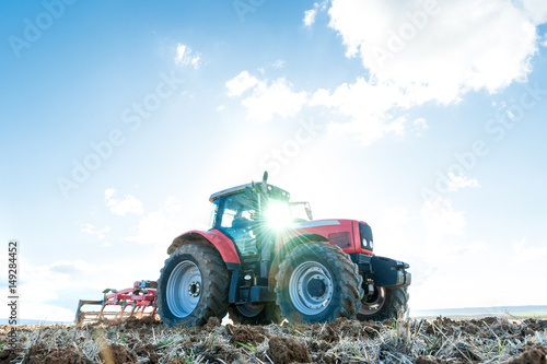 tractor in the lands along with gear for work.