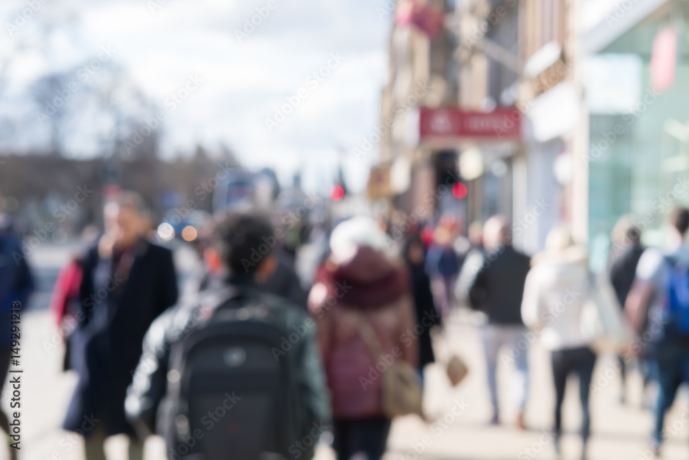 Blurred image of People walking on the street, with car, building in background. On Princes Street, the main shopping street in Edinburgh, United Kingdom. Blurred image of People walking on the street, with car, building in background. On Princes Street, the main shopping street in Edinburgh, United Kingdom.