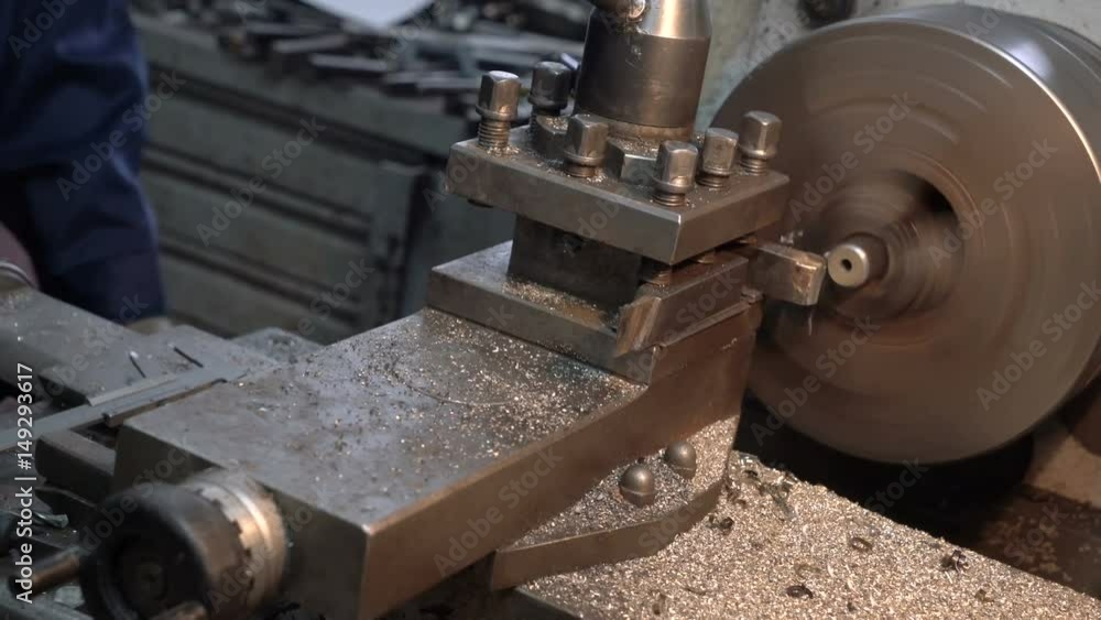 Steel metal cutting machine process by lathe in the car workshop. Steel metal cutting machine process by lathe in the car workshop.