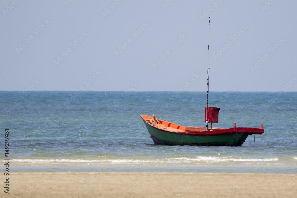 Image of small boat sitting on the beach. Image of small boat sitting on the beach.