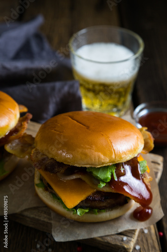 Hamburgers and beer on a wooden table