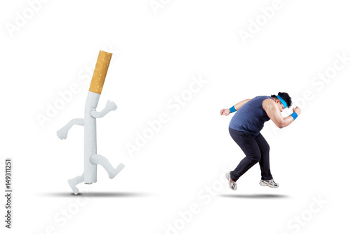 Overweight man is chased by a cigarette