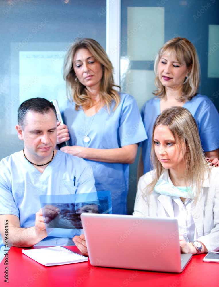 Dentist team working together in dental office Dentist team working together in dental office