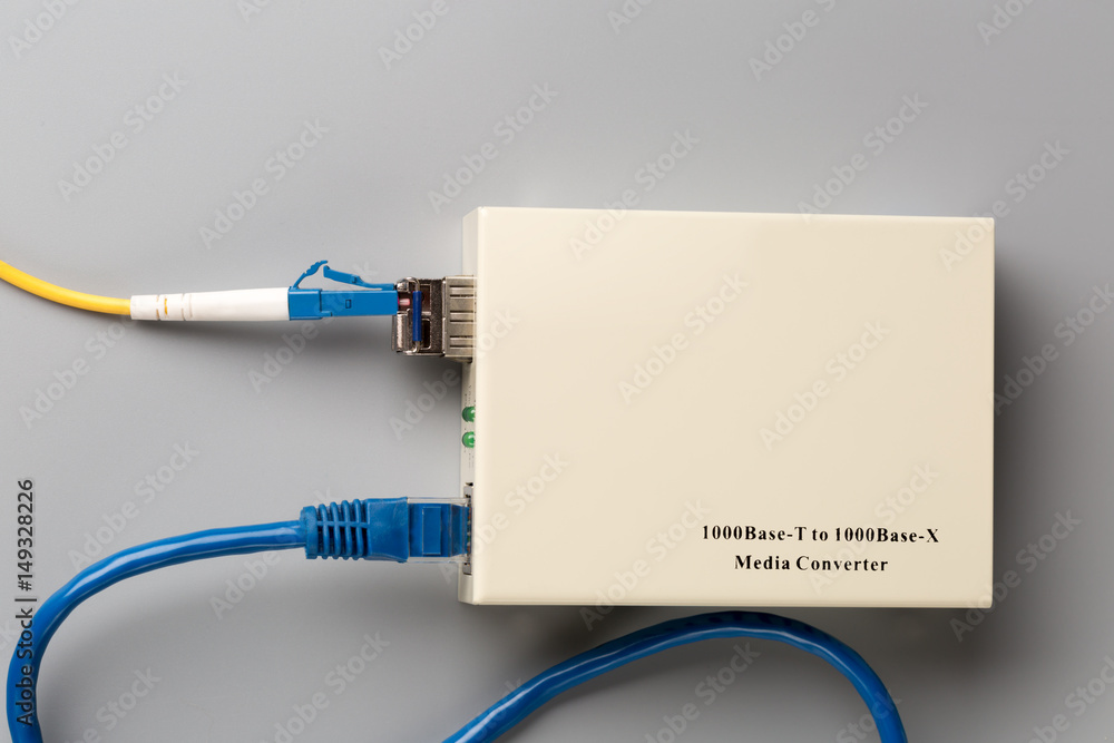 1Gbps optical media converter with SFP module connected to fiber patch cord and copper patch cord 1Gbps optical media converter with SFP module connected to fiber patch cord and copper patch cord