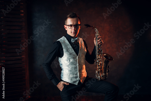 Εκτύπωση καμβά Male saxophonist posing with saxophone, jazz man