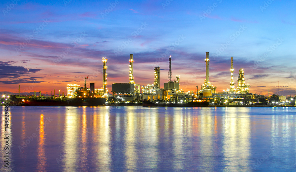 oil refinery industry plant along twilight morning,pink sky
