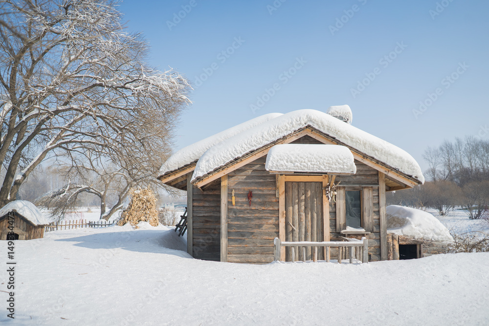 Beautiful wooden house snow covered in China