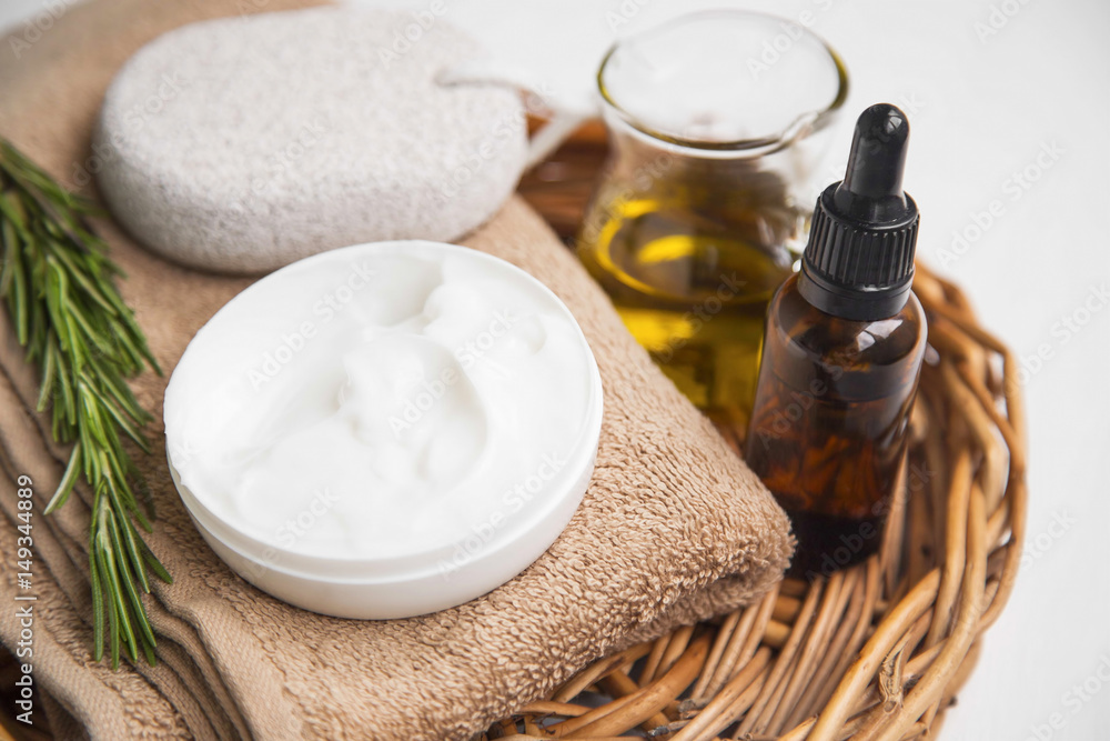 Natural skin cream with rosemary herb and essential oil, organic spa products still life Natural skin cream with rosemary herb and essential oil, organic spa products still life