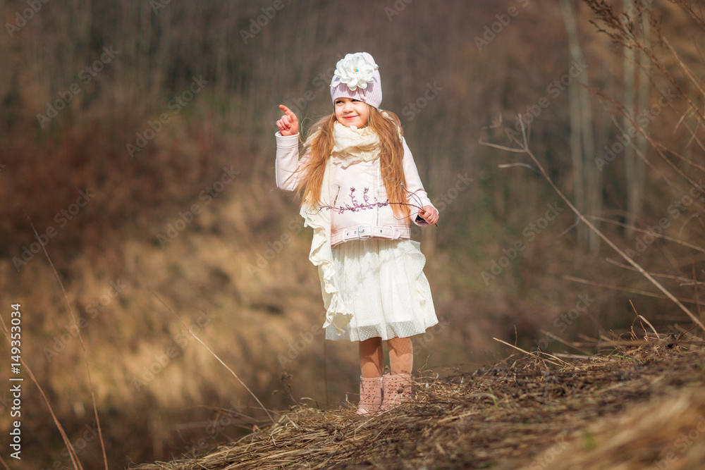 Little girl is walking in the park. Spring. Outdoor. . Little girl is walking in the park. Spring. Outdoor. .