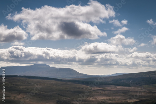 Ingleborough, one of the three peaks in the Yorkshire Dales, with Morecambe bay in the distance.