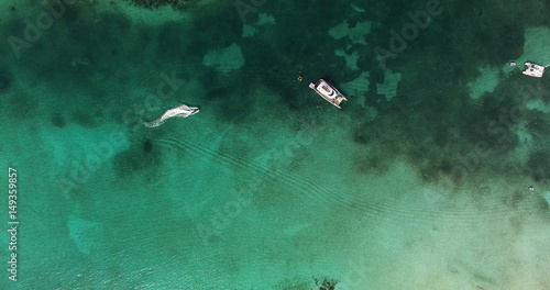Top View of a yacht on green reef ocean, Bahamas 