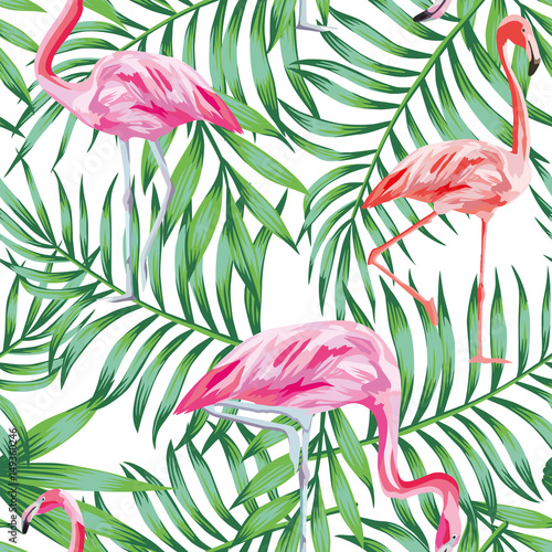 Bird flamingo on a background of tropical leaves seamless patter