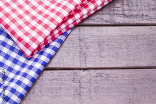 Red and blue table cloth on wooden background