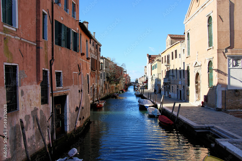 Impression of Venice with its beautiful canals, boats and old houses, Italy