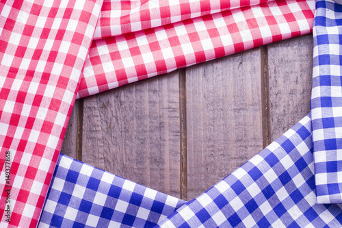 Red and blue table cloth on wooden background