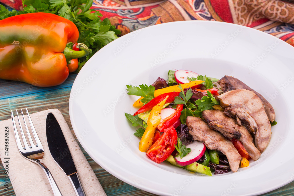 Mutton uvulas with salad and paprika, is served in dressing from olive oil Mutton uvulas with salad and paprika, is served in dressing from olive oil