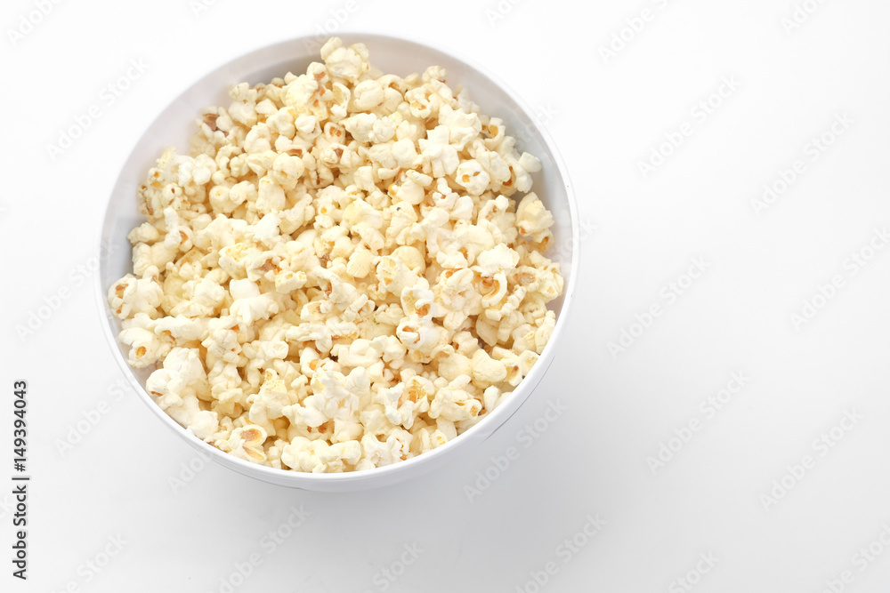 Popcorn in the bowl on white background - Soft focus Popcorn in the bowl on white background - Soft focus