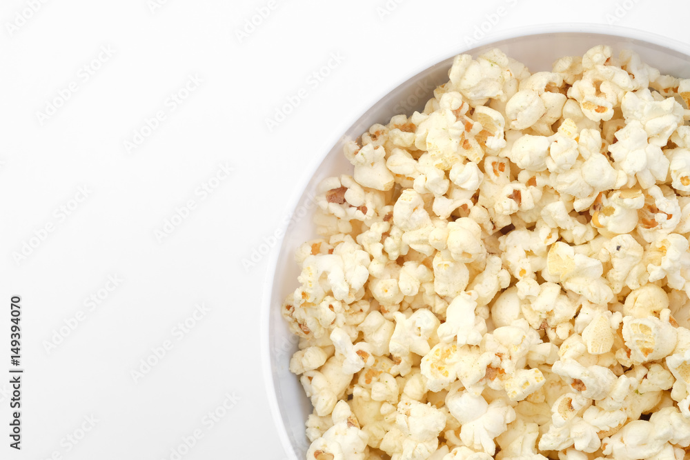 Popcorn in the bowl on white background - Soft focus Popcorn in the bowl on white background - Soft focus