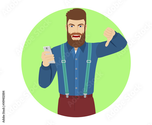 Hipster with mobile phone showing thumb down gesture as rejection symbol