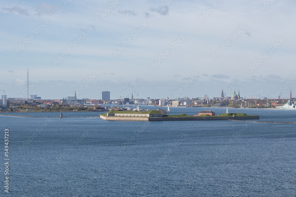 Copenhagen cityscape. Seen from the Oresund strait, in a southwest direction. Copenhagen is the capital of Denmark. Wide angle view.